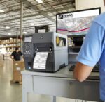 Zebra zt411 label printer in a warehouse setting, printing labels for logistics and inventory management