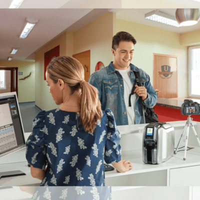 Zebra zc300 printer in use at a medical clinic front desk for staff and visitor id card printing.