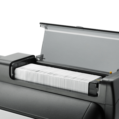 Customer testimonial with Zebra ZXP Series 7 Card Printer and printed blank ID cards on display.