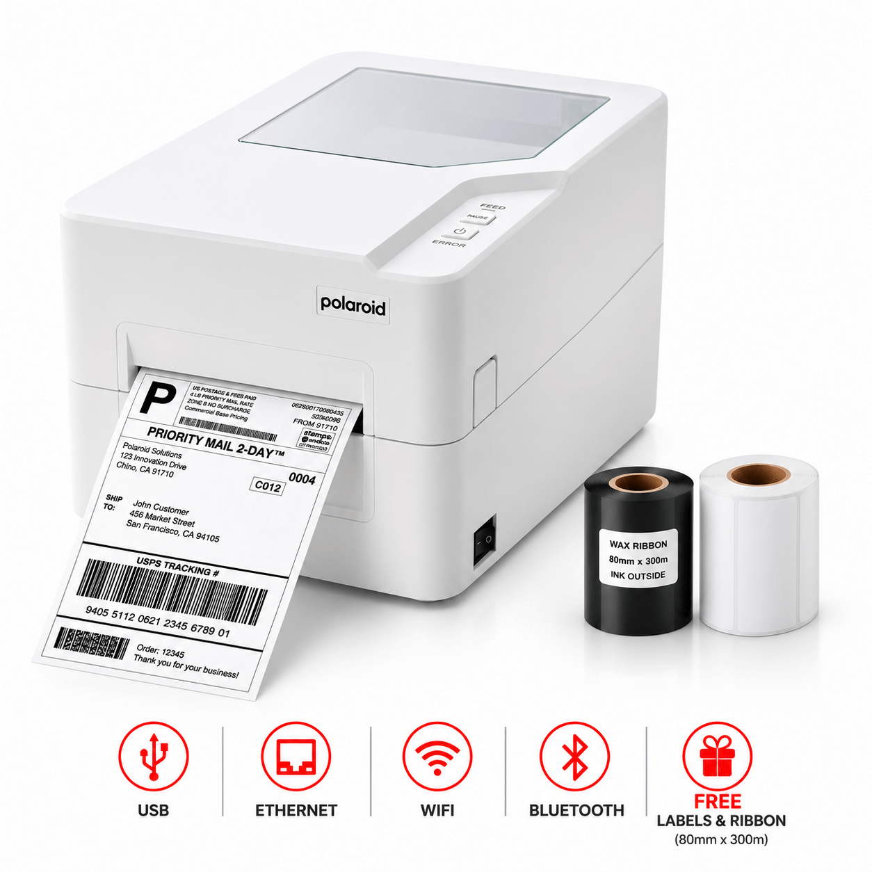 Polaroid label printer with printed shipping label, plus black and white label rolls nearby.